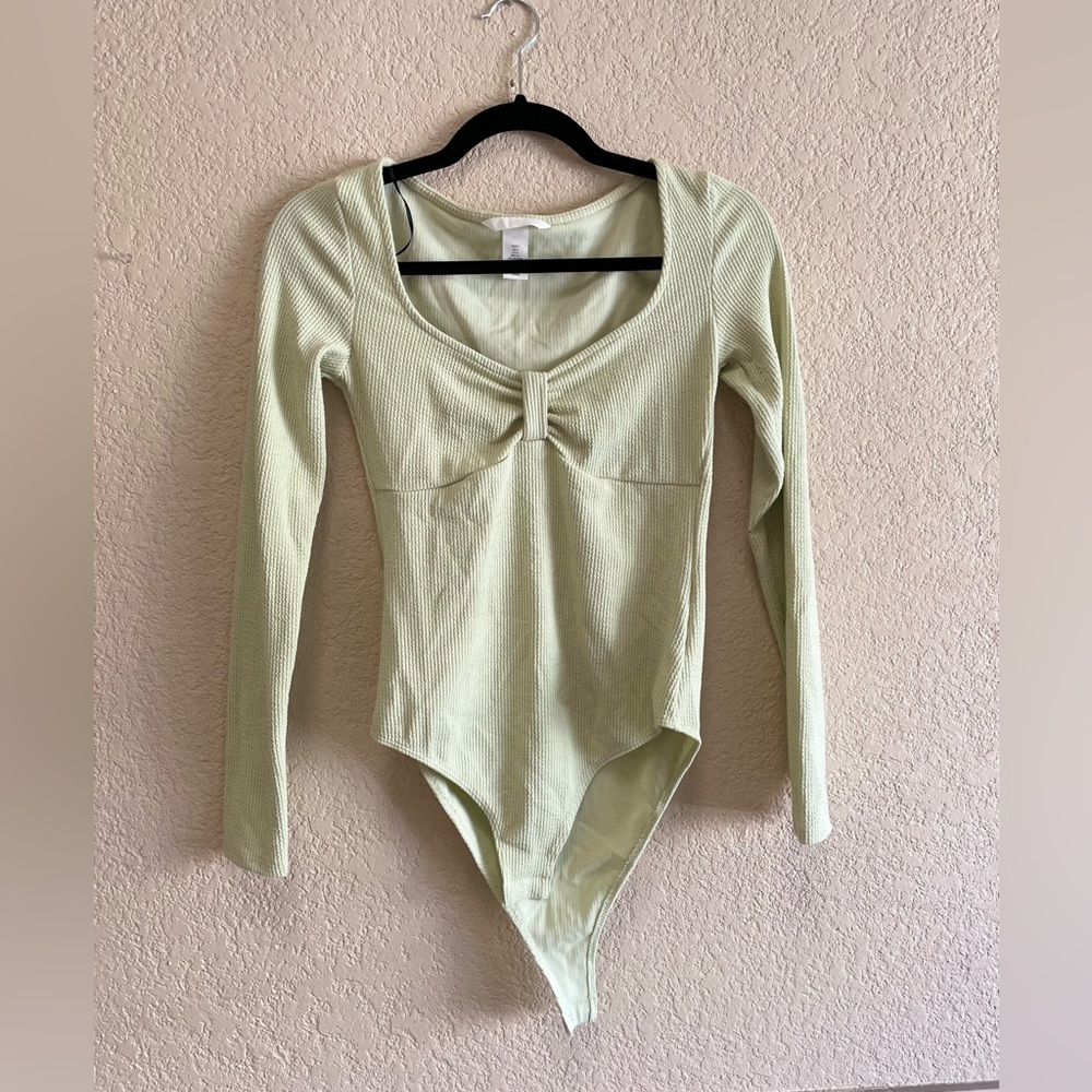 pastel green body suit